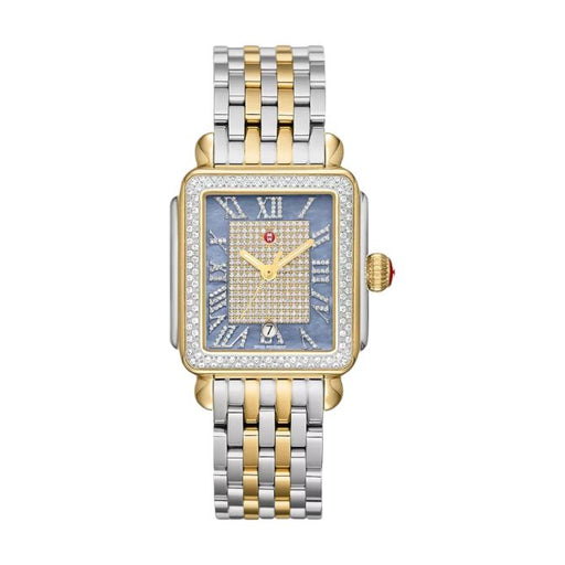 A luxury two-tone watch with a square gold and silver stainless steel case, a blue dial with a diamond-encrusted center and Roman numeral hour markers, and a matching two-tone link bracelet.