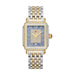 A luxury two-tone watch with a square gold and silver stainless steel case, a blue dial with a diamond-encrusted center and Roman numeral hour markers, and a matching two-tone link bracelet.