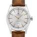 Hamilton automatic wristwatch with a silver sunburst dial, gold-tone hands and markers, and a brown leather strap on a white background.