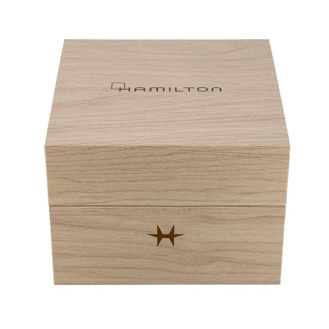 A light natural wood presentation box with the HAMILTON brand name engraved on the top lid and a star logo on the front, shown against a plain white background.