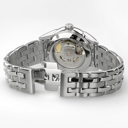 Silver watch with open face on a white background