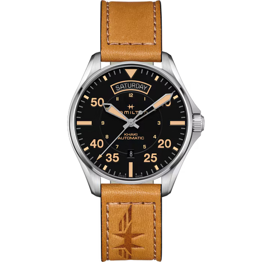 A Hamilton Kiki Automatic watch featuring a black dial with orange-tinted markers and hands, a silver-tone stainless steel case, and a tan leather strap with a debossed logo.