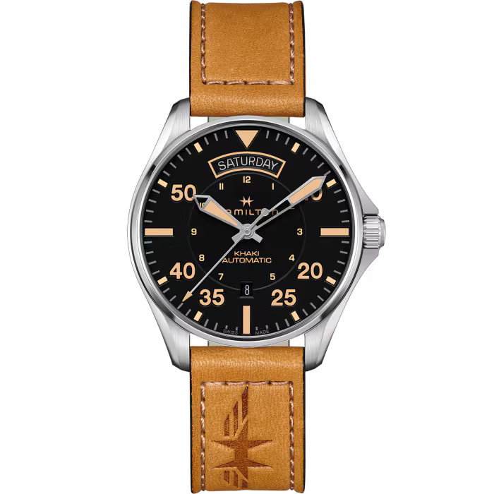 A Hamilton Kiki Automatic watch featuring a black dial with orange-tinted markers and hands, a silver-tone stainless steel case, and a tan leather strap with a debossed logo.