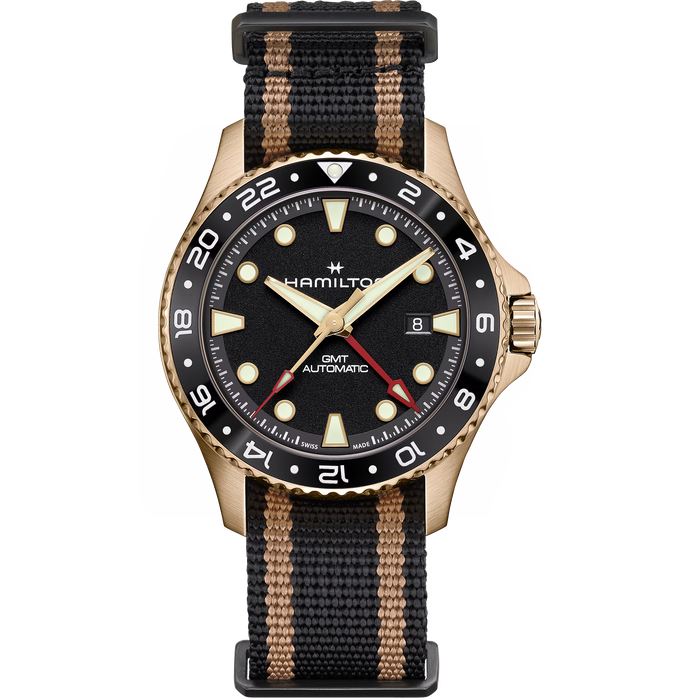 Hamilton watch with a black dial, black and tan striped nylon strap, and a bronze-toned case on a white background.
