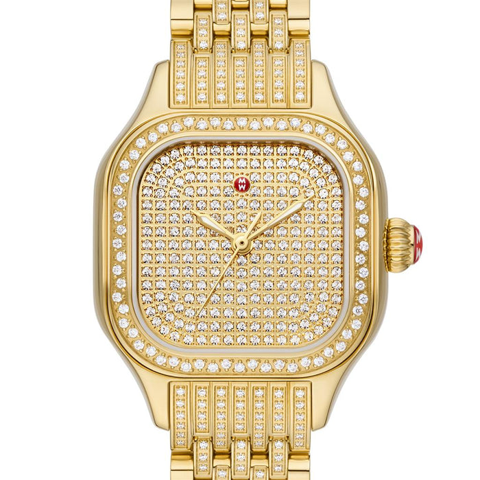Gold watch with diamond accents on a white background