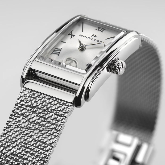 Silver Hamilton watch with mesh band on a light gray background