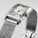 Silver Hamilton watch with mesh band on a light gray background