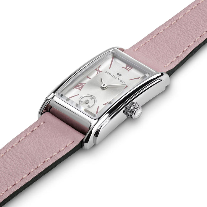 Hamilton watch with pink strap on a white background