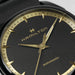 Hamilton watch with black face and gold accents