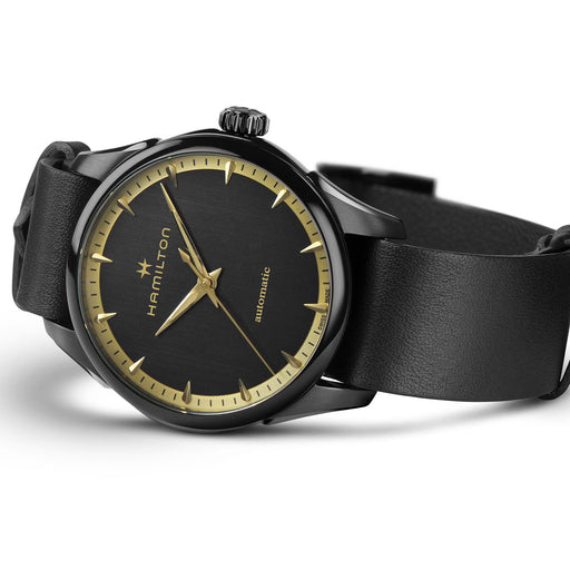 Black watch with gold accents on a white background