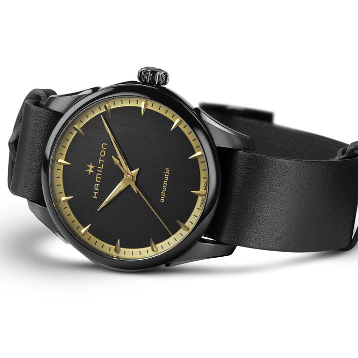 Black watch with gold accents on a white background