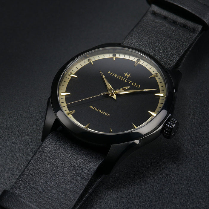 Hamilton watch with black strap and black dial on a dark background
