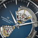 Hamilton watch with open face design showing mechanical components on a blue background
