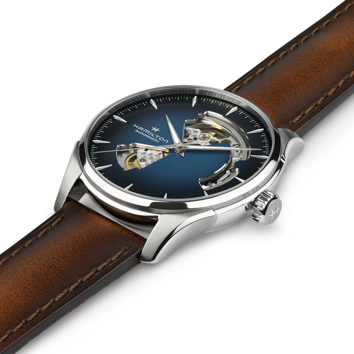 Watch with brown leather strap and blue face on a white background