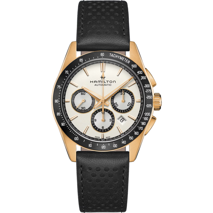 Hamilton Automatic watch with a gold-tone case, black bezel, cream-colored dial, and a black perforated leather strap, shown against a plain white background.