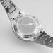 Silver Hamilton watch with detailed engraving on a light gray background