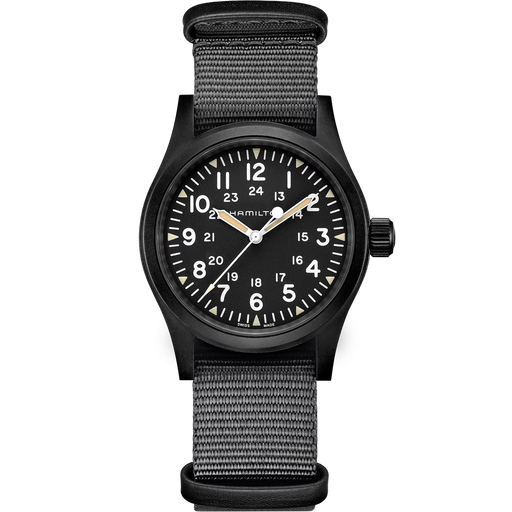 A black military-style analog watch with a black dial, white numerals, and a black woven fabric strap, shown against a plain white background.