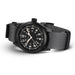 Black watch with a gray strap on a white background