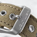 Close-up of a silver buckle on a brown leather strap with 'Hermes' branding.