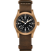 Watch with brown leather strap and black dial on a white background