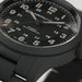 Hamilton watch with black dial and black strap on a light gray background