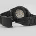 Black Hamilton watch with open face on a light gray background