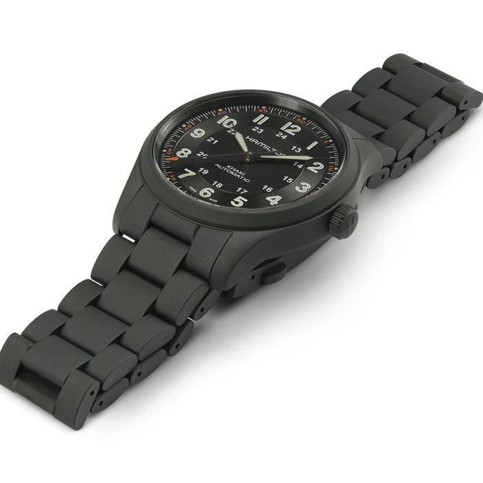 Black wristwatch with a detailed face on a white background