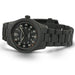 Black wristwatch with detailed face on a white background