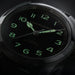 Hamilton watch with green glowing numbers on a dark background