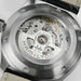 Close-up of a Hamilton watch mechanism with visible branding.