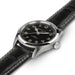 Hamilton watch with black dial and leather strap on a white background