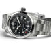 Silver wristwatch with black dial on a white background