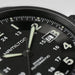 Close-up of a Hamilton watch face with black dial and white markings.