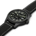 Black wristwatch with detailed face on a white background