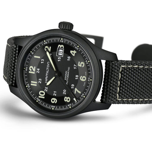 Black Hamilton watch with detailed face on a white background