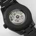 Close-up of a Hamilton watch with visible mechanical components on a light gray background