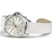 Watch with white strap and silver case on a white background