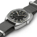 Hamilton watch with black dial and gray strap on a white background