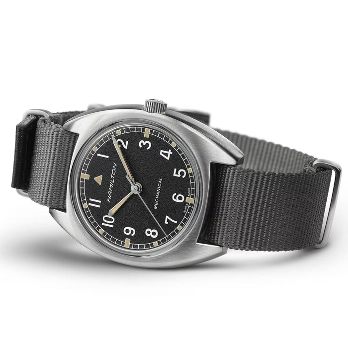 Hamilton watch with black dial and gray strap on a white background