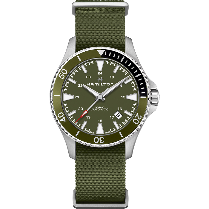 Hamilton watch with an olive green dial and matching green nylon strap, featuring a silver stainless steel case and a black rotating bezel.