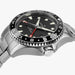 Silver watch with black dial on a white background