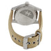 Close-up of a watch with a beige strap and silver case on a white background