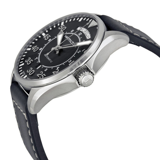 Wristwatch with black dial and leather strap on a white background